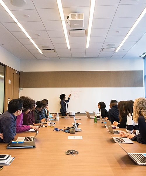 Colleagues in a boardroom meeting.