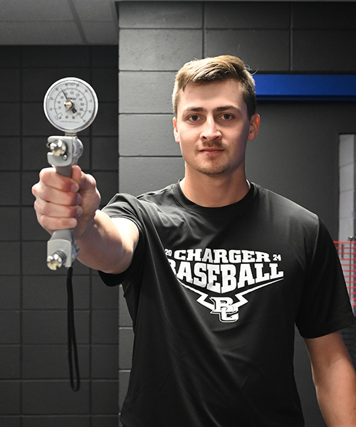 Male student practicing grip strength