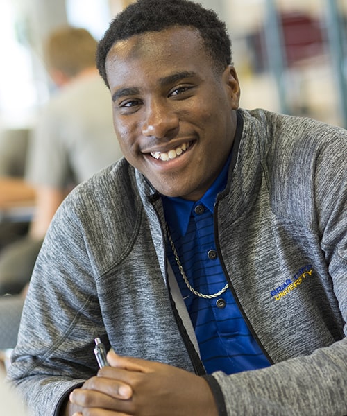 Male student working on homework.