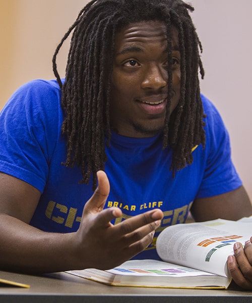 Male student working on homework.