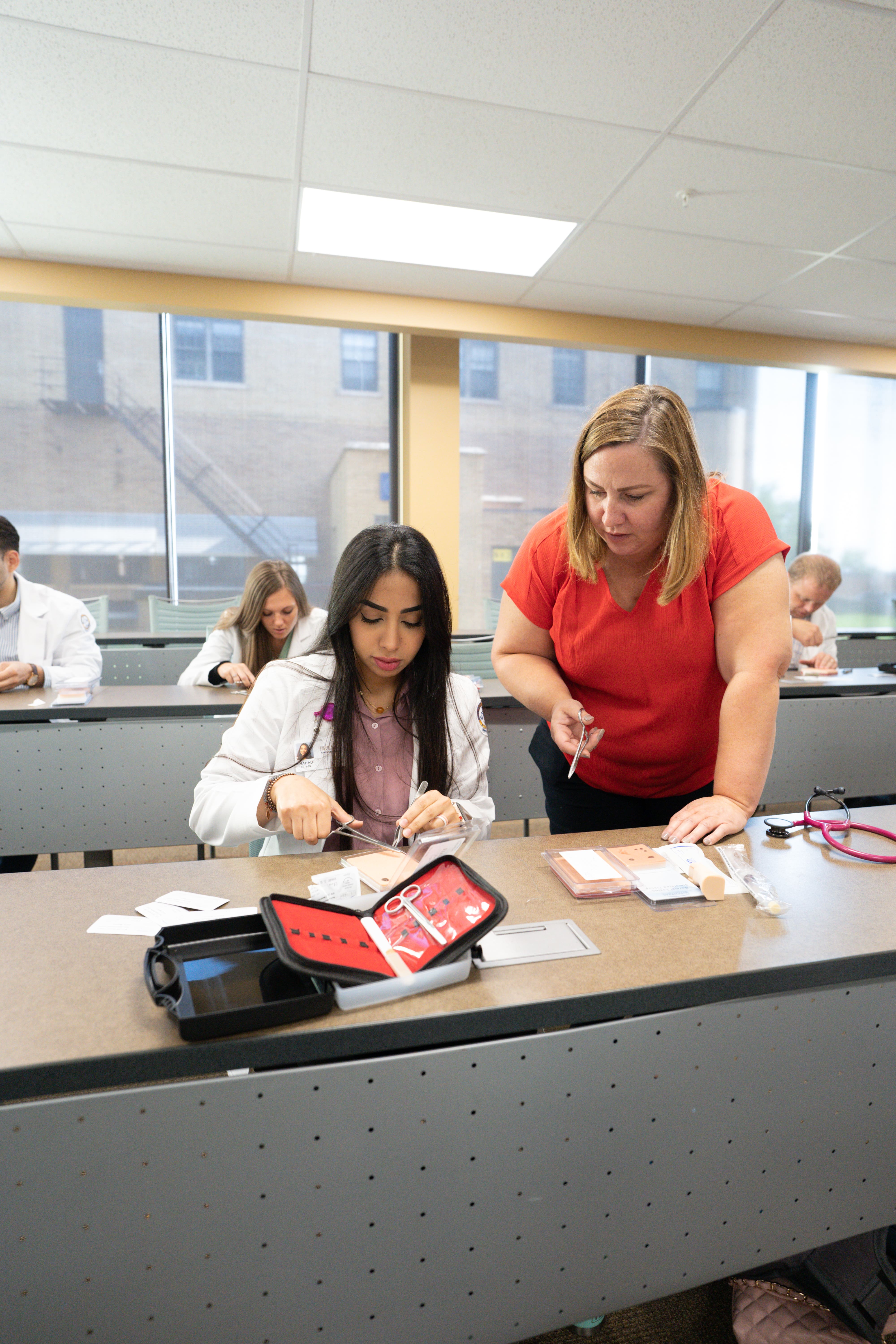 Professor assisting nursing graduate student